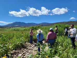 Students in discussion with rancher